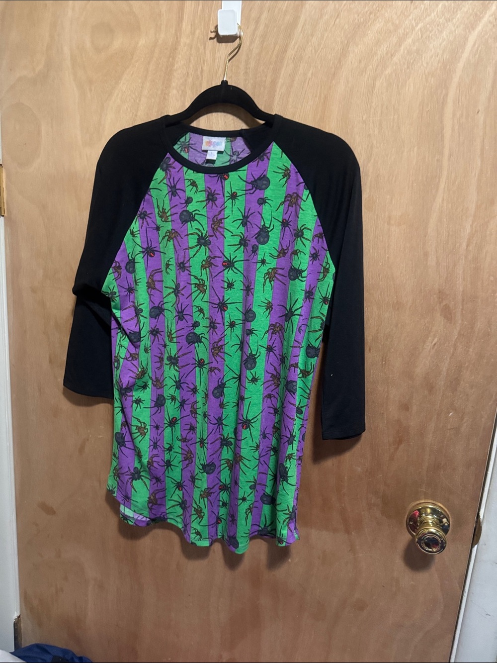 LuLaRoe Black Raglan Top with Green and Purple Spider Stripe Print